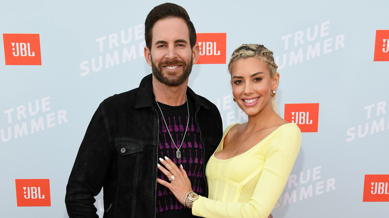 Tarek El Moussa and Heather Rae El Moussa pose for a picture at the  JBL True Summer event