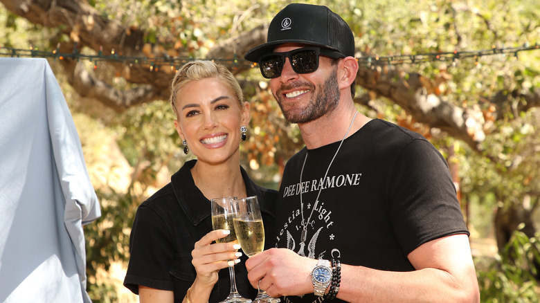 Tarek El Moussa and Heather Rae El Moussa having drinks at a bridal shower for an animal rights activist