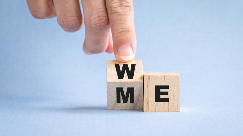 Hand with "me" dice