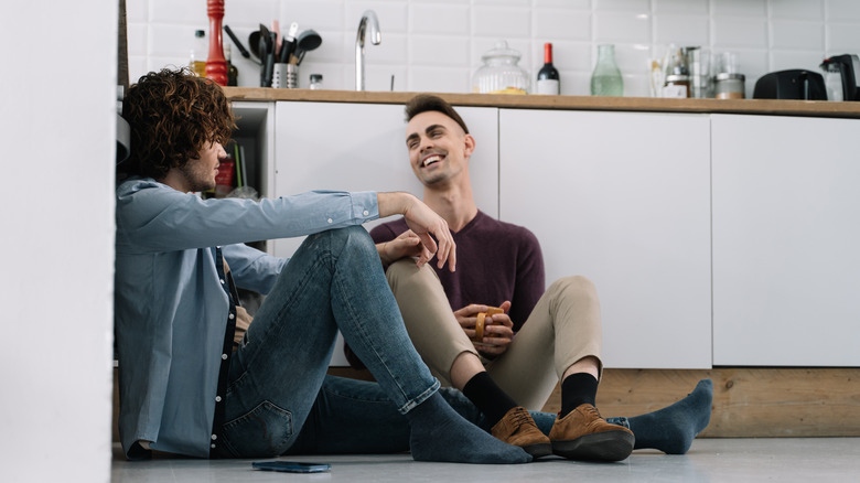 two men talking and laughing