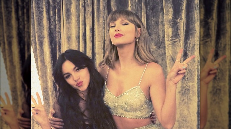 Taylor Swift and Olivia Rodrigo posing for photos