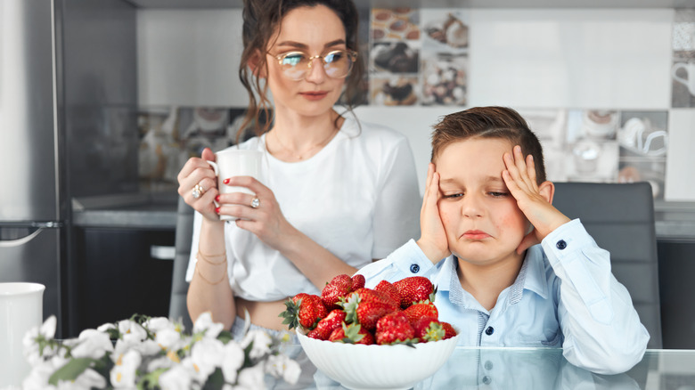 a boy has a food allergy to strawberries