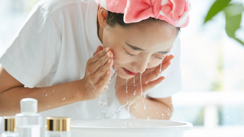 woman washing face