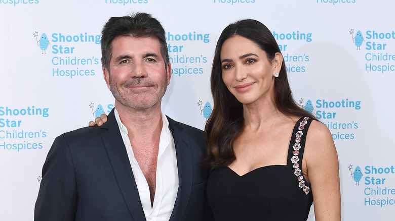 Simon Cowell & Lauren Silverman posing