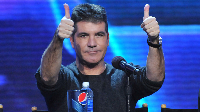 Simon Cowell giving two thumbs up