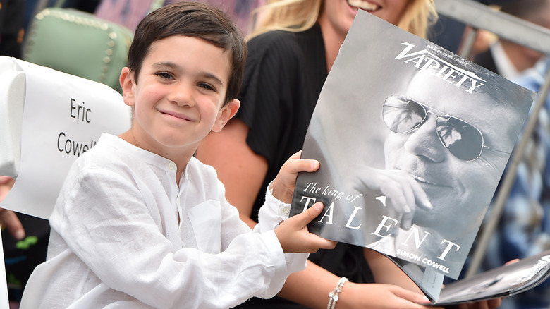 Eric Cowell holding a magazine 