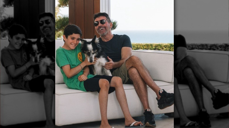 Eric Cowell and Simon Cowell with a dog