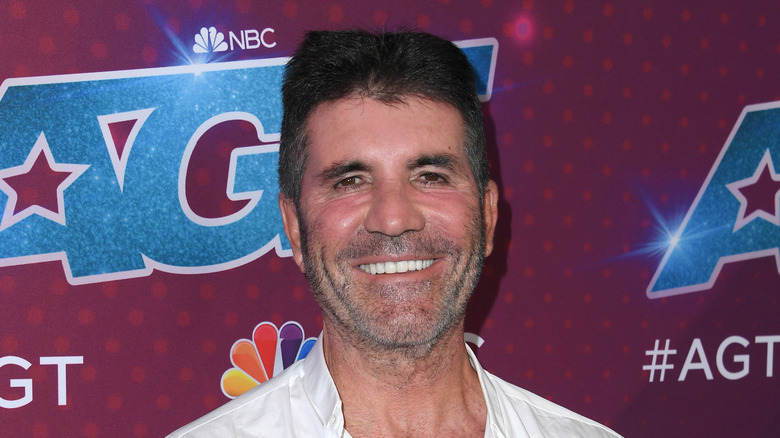 Simon Cowell smiling in 2022