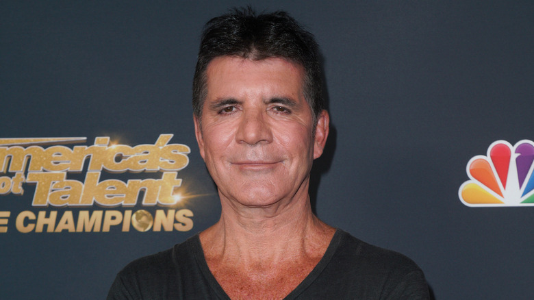 Simon Cowell posing in 2021