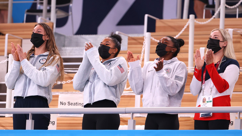 Grave McCallum, Jordan Chiles, Simone Biles, and Mykayla Skinner