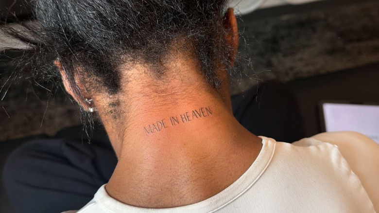 A close-up of Simone Biles' neck tattoo reading