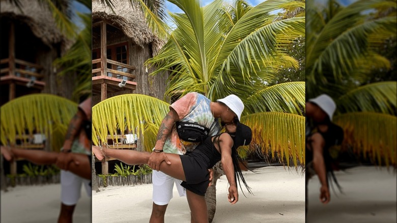 Simone Biles and husband Jonathan Owens kiss on beach