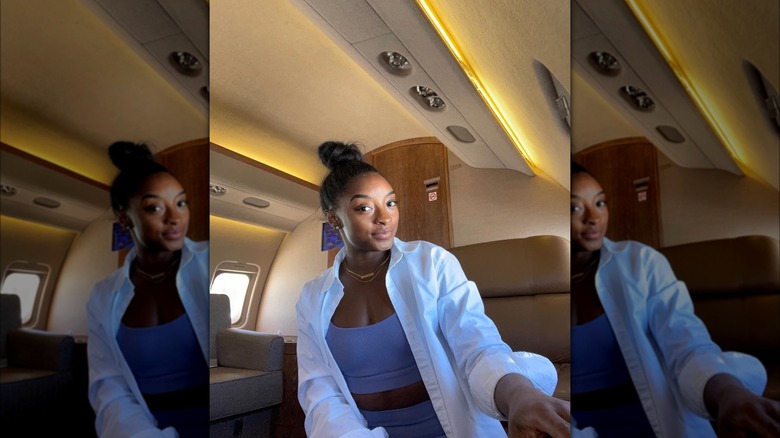 Simone Biles poses in a private jet 