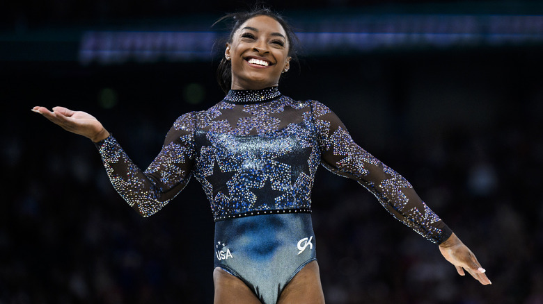 Simone Biles posing and smiling 2024 Paris Olympics