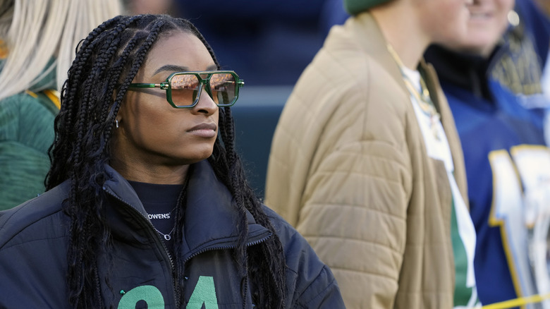 Simone Biles on the sideline of a Green Bay Packers game