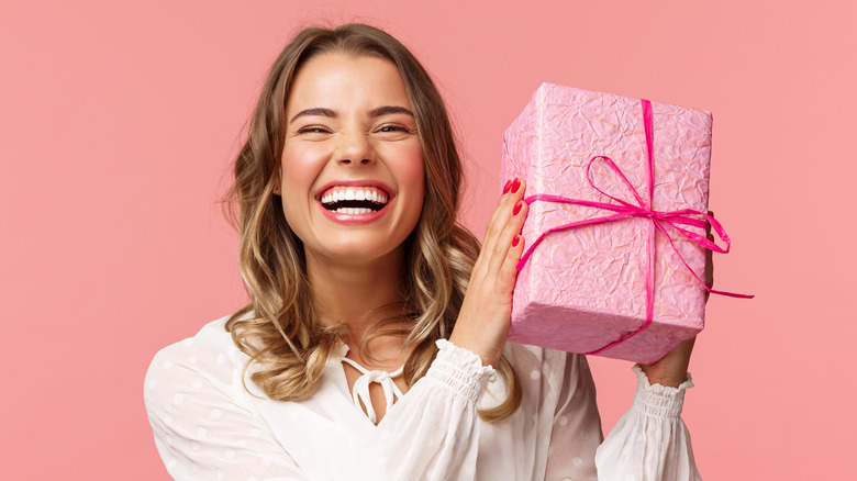 happy woman holding gift