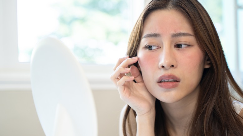 Woman with makeup allergy