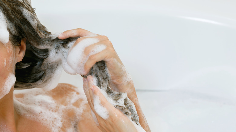 Washing hair with shampoo