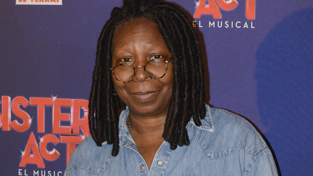 Whoopi Goldberg posing with glasses