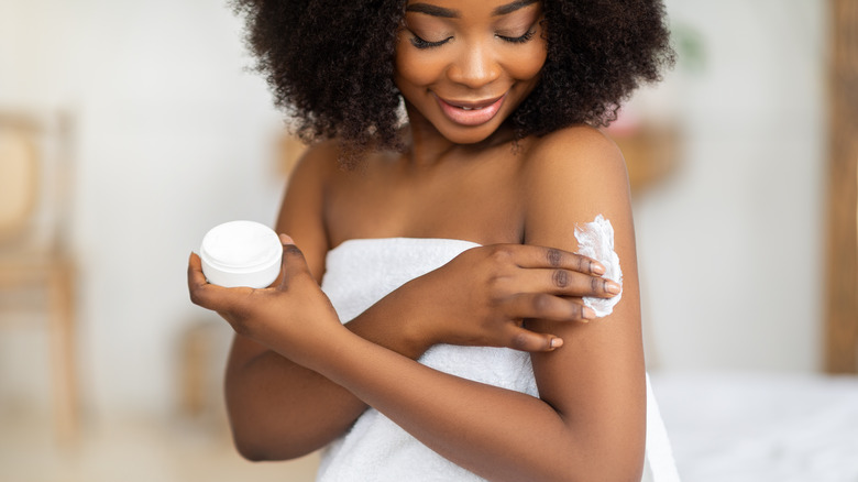 woman applying lotion