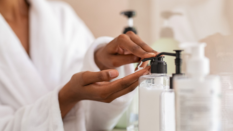 Woman using moisturizer