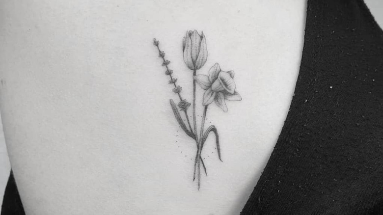 floral tatto on rib cage by danielnijveld_com