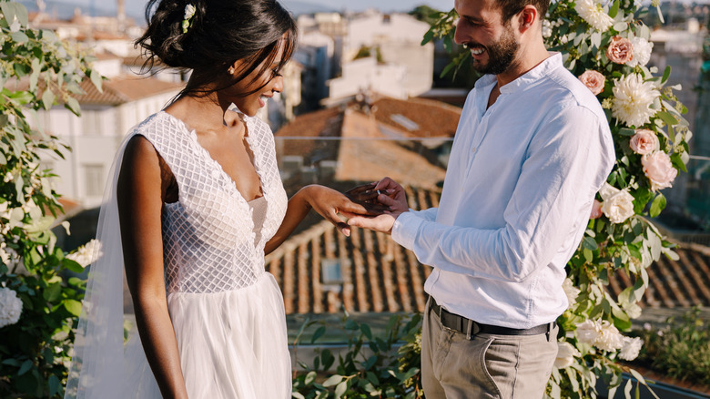 couple exchanging rings