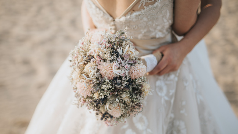 bride holding a bouquet of flowers