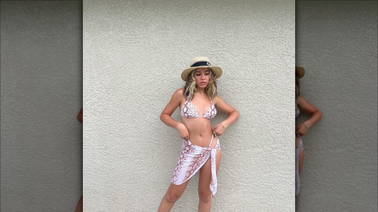 woman wearing snake skin bikini