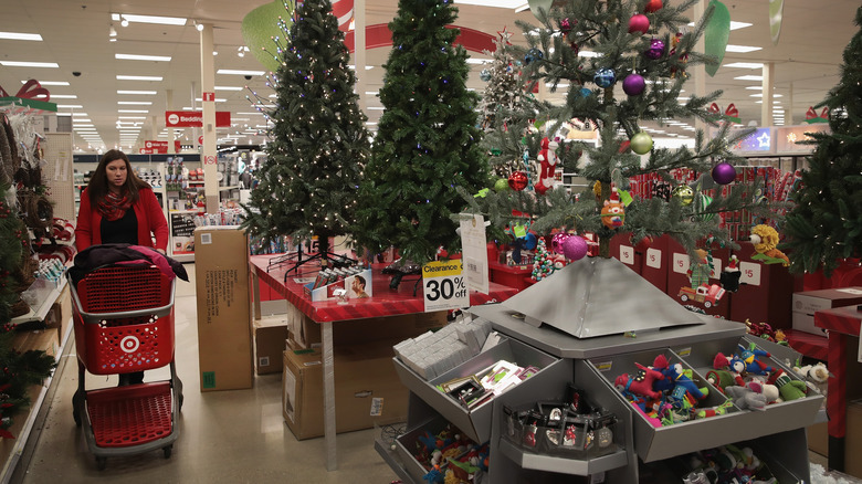 A woman shopping at a target store in the holiday section