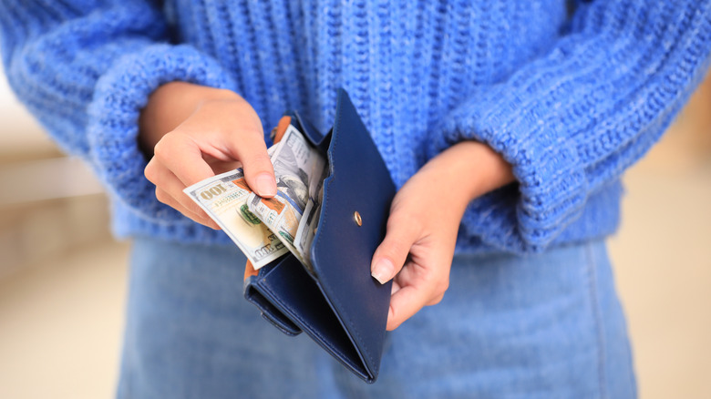 woman holding wallet