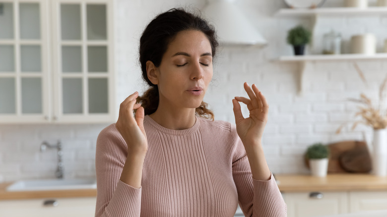 A woman practising breathing techniques