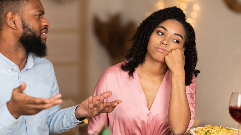 Woman looks away from date