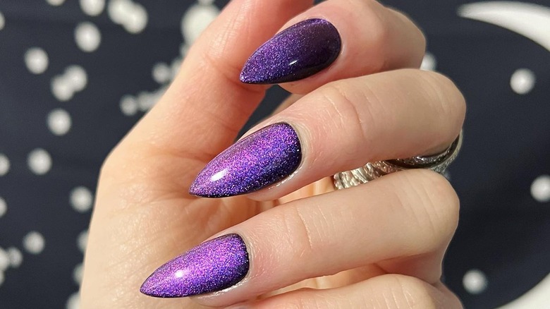 Black nails with purple sparkles