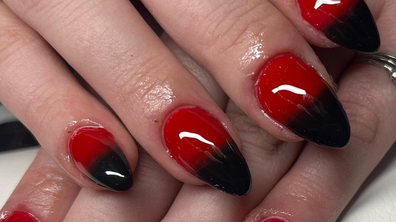 Shiny red nails with black