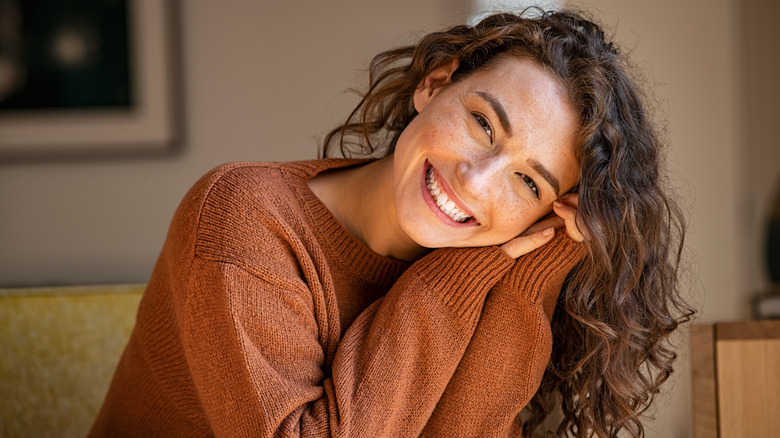 Relaxed, happy woman smiling 