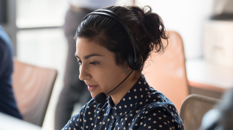 woman working at helpline call center 