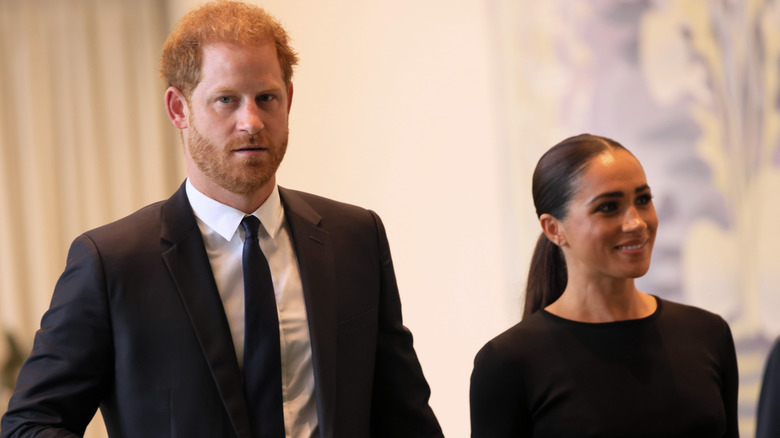 Prince Harry and Meghan Markle walking