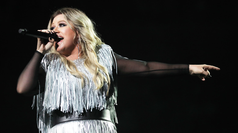 Kelly Clarkson performing on stage