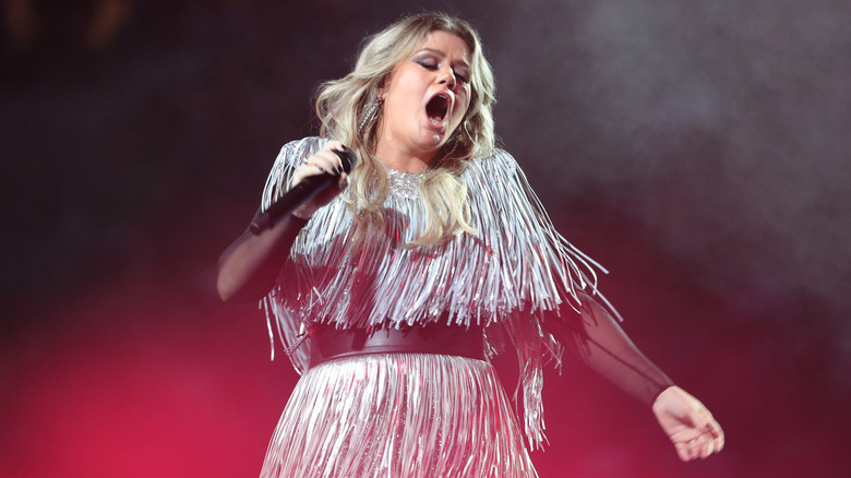 Kelly Clarkson performing onstage