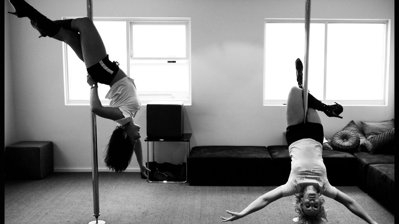 two women pole dancing