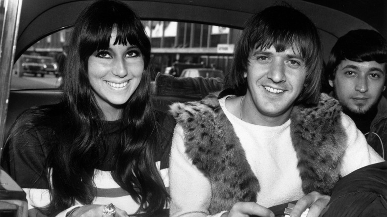 Cher and Sonny Bono in a car black and white