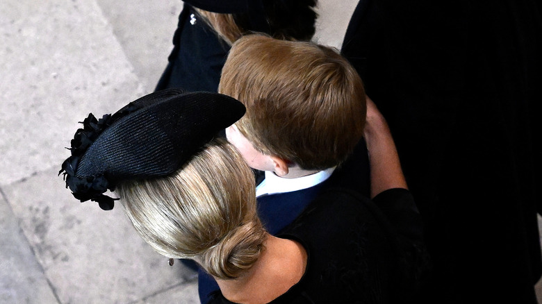 Sophie with arm around Prince George at funeral