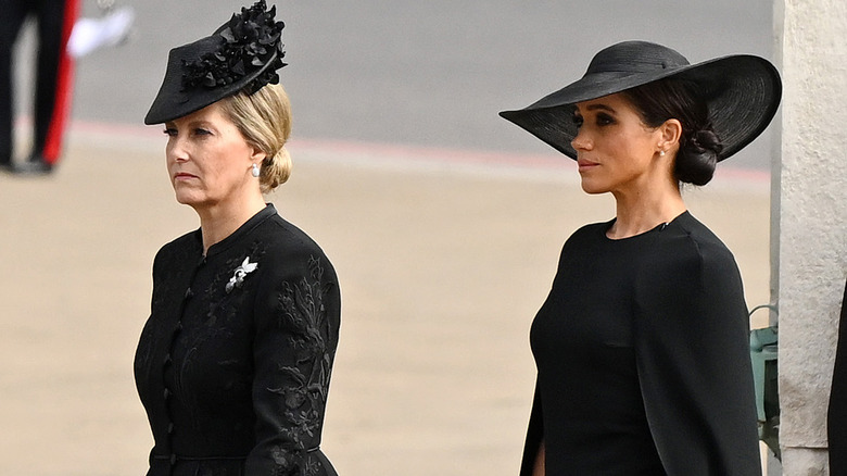 Sophie, Countess of Wessex and Meghan Duchess of Sussex walking 