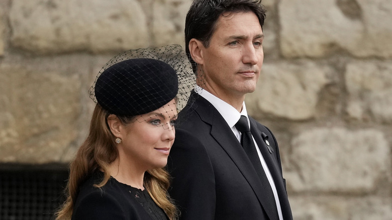 Sophie Grégoire Trudeau and Justin Trudeau looking somber