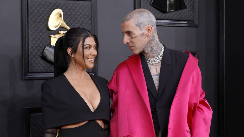 Kourtney Kardashian and Travis Barker posing