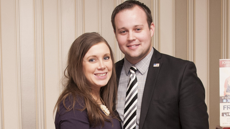 Anna and Josh Duggar standing together before he went to jail