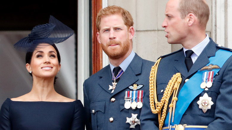 Meghan smiles and William frowns