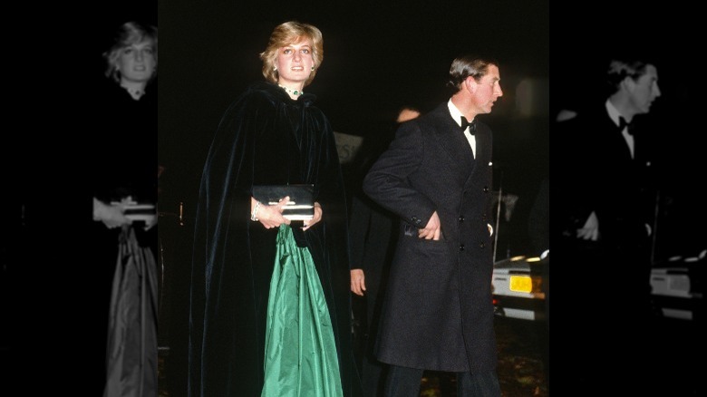 Princess Diana and King Charles walking outside