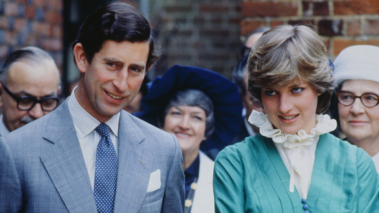 Young King Charles and Princess Diana smiling